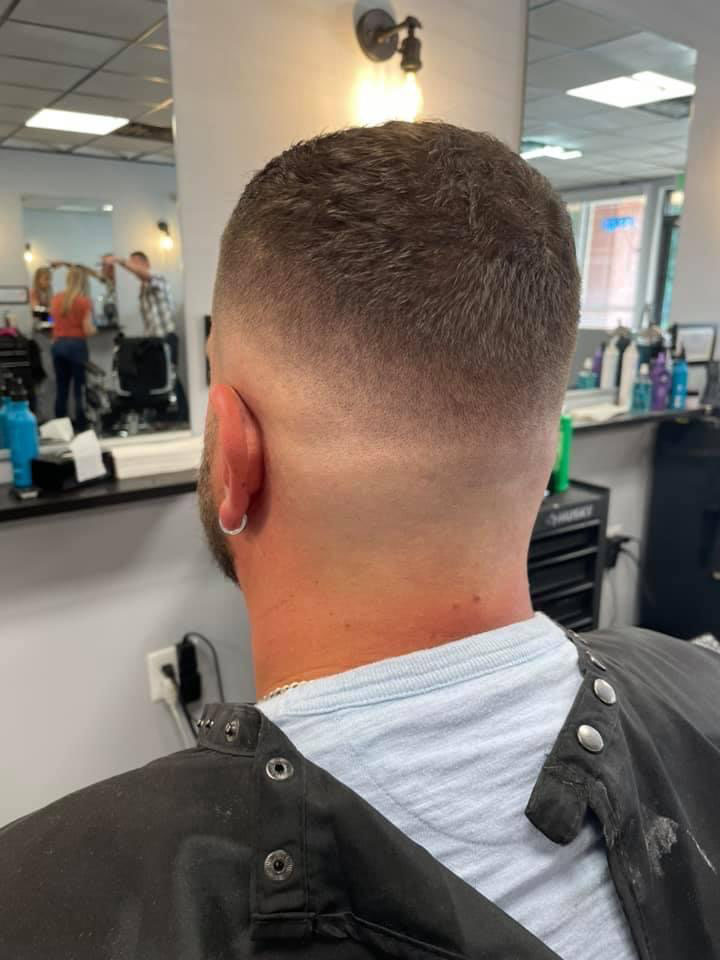 Clean burst fade from the back at Work of Art Barbershop