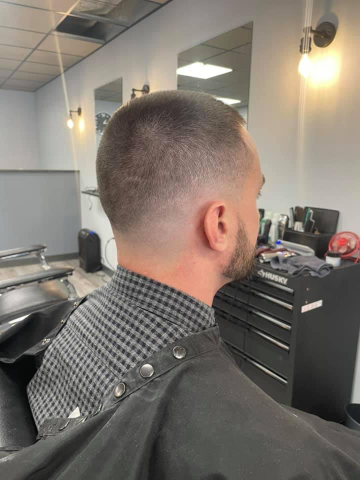 Buzz cut with high fade from the back at Work of Art Barbershop