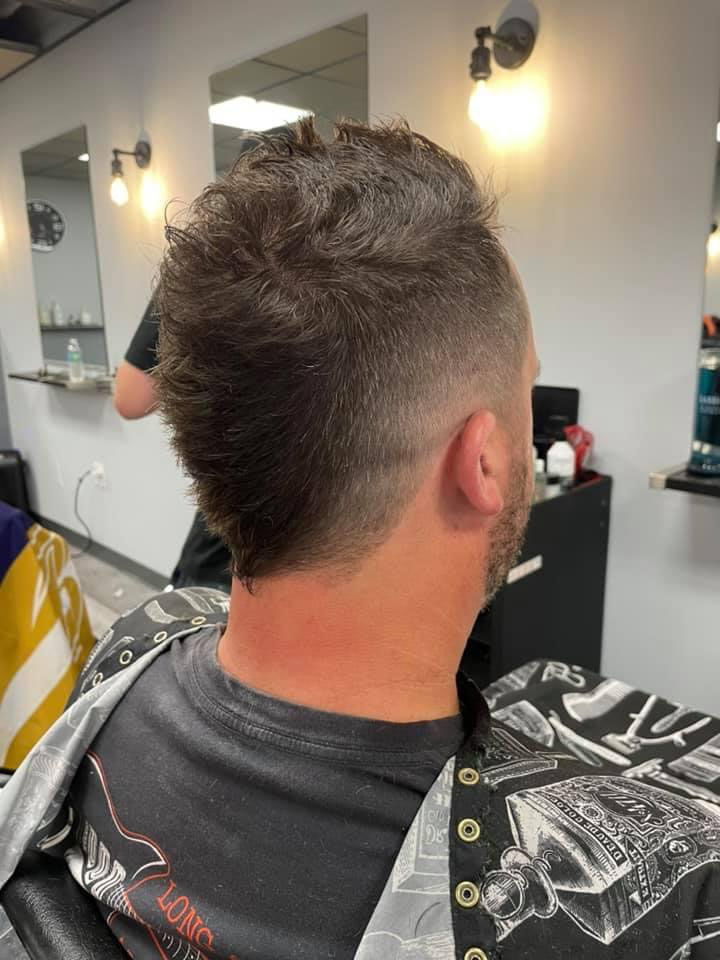 Textured faux hawk with mullet fade at Work of Art Barbershop