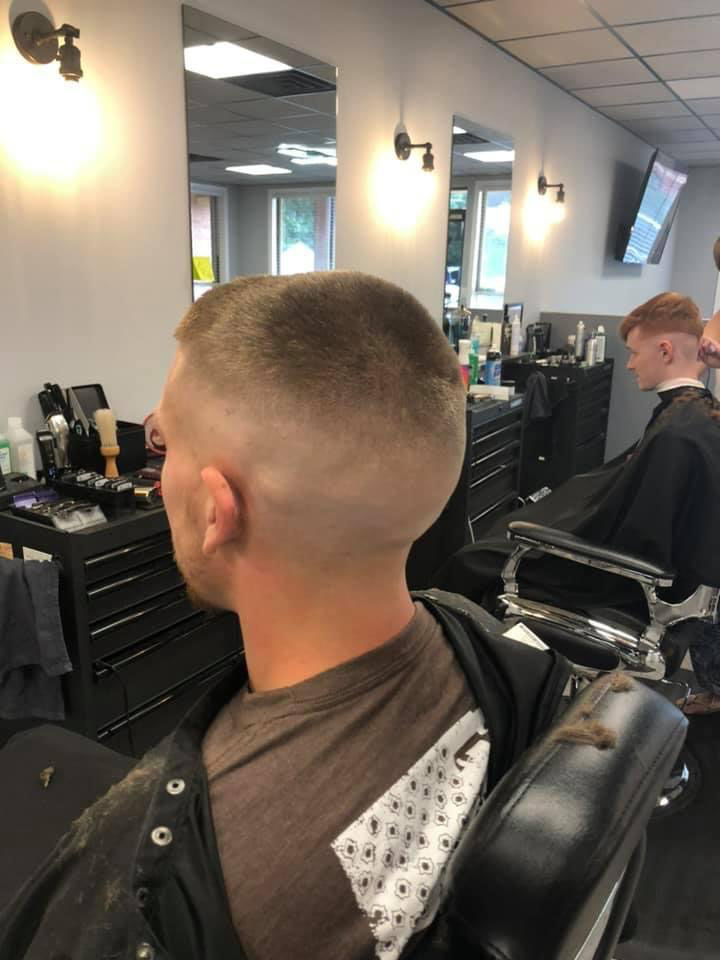 Induction buzz cut with high fade at Work of Art Barbershop